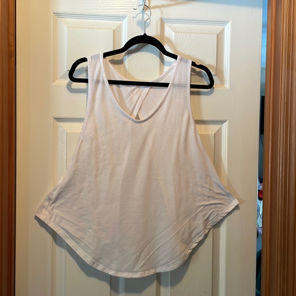 White shirt , don’t know name, size med